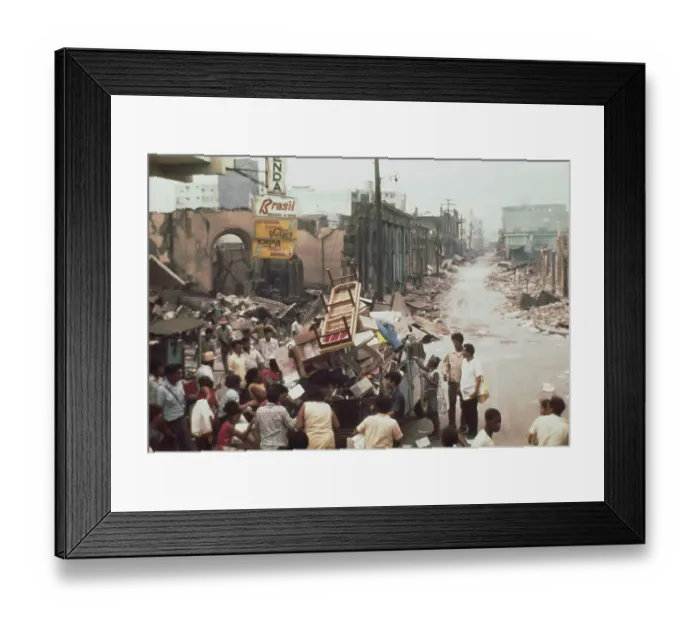Framed Print : A man and his family carry possessions from their ruined home in Managua Framed Print : A man and his family carry possessions from their ruined home in Managua