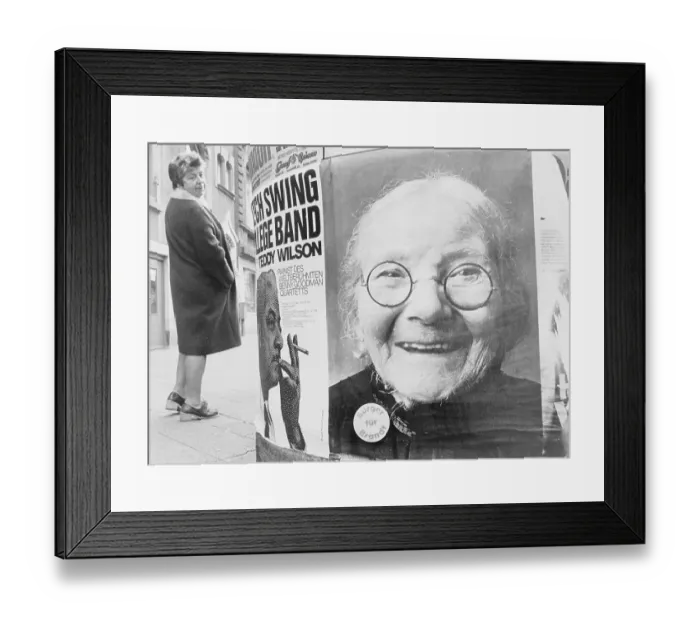Framed Print : Woman Looking at a Poster Framed Print : Woman Looking at a Poster