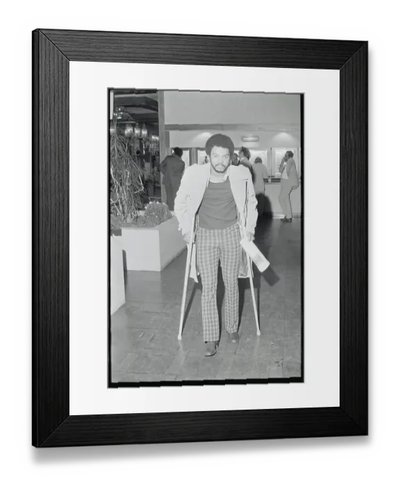 Framed Print : Reggie Jackson Walking on Crutches