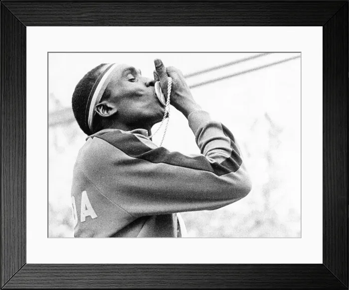 Framed Print : Ugandan Hurdler John Akii-Bua Kissing Gold Medal