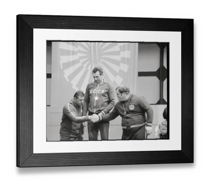 Framed Print : Two Wrestlers Shaking Hands on Olympic Podium Framed Print : Two Wrestlers Shaking Hands on Olympic Podium