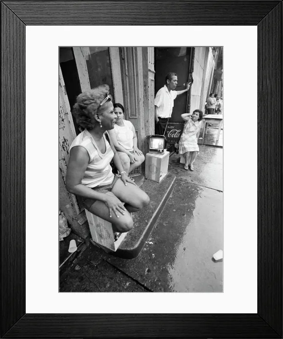 Framed Print : People Seated Outside Watching Tv Framed Print : People Seated Outside Watching Tv
