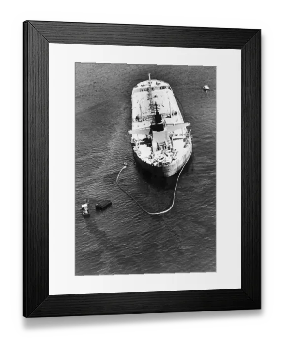 Framed Print : Oil Spill. An oil slick can be seen covering the water around the tanker Tamano Framed Print : Oil Spill. An oil slick can be seen covering the water around the tanker Tamano
