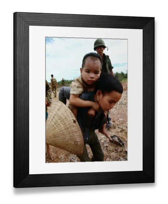 Framed Print : Refugee Girl Carrying Little Boy Framed Print : Refugee Girl Carrying Little Boy