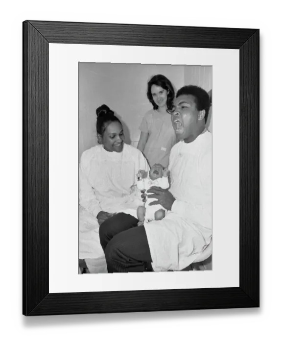 Framed Print : Muhammad Ali Holding His Newborn Son Framed Print : Muhammad Ali Holding His Newborn Son