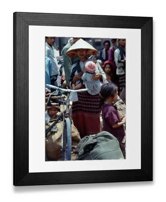 Framed Print : Refugee Woman Holding Her Child Framed Print : Refugee Woman Holding Her Child