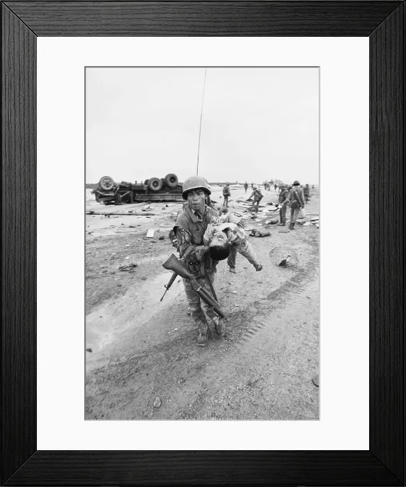 Framed Print : Soldier Carrying Wounded Youngster Framed Print : Soldier Carrying Wounded Youngster