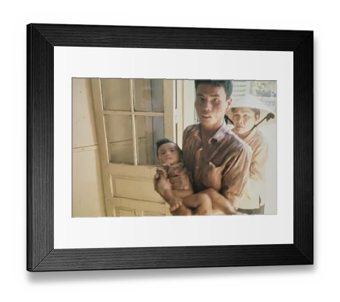 Framed Print : Father & Wounded Child, Vietnam War Framed Print : Father & Wounded Child, Vietnam War