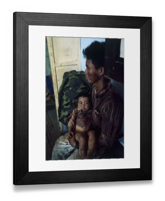 Framed Print : Vietnamese Father Holding His Child Framed Print : Vietnamese Father Holding His Child