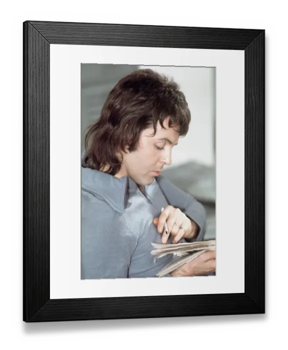 Framed Print : Paul McCartney Seated and Reading Framed Print : Paul McCartney Seated and Reading
