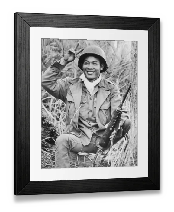 Framed Print : Vietnamese Soldier Smiling and Making the Peace Sign Framed Print : Vietnamese Soldier Smiling and Making the Peace Sign