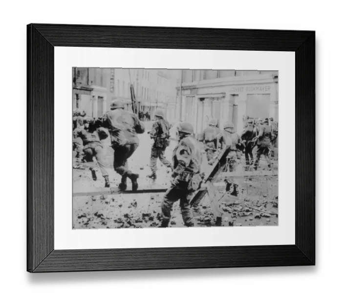 Framed Print : Troops Jumping over Barbed Wire on Bloody Sunday Framed Print : Troops Jumping over Barbed Wire on Bloody Sunday
