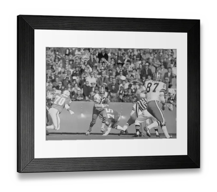 Framed Print : Roger Staubach Eluding Tackle