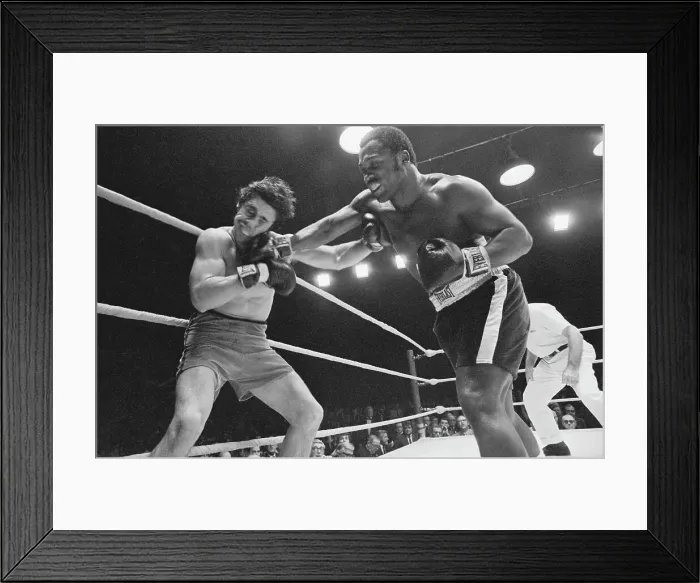 Framed Print : Joe Frazier and Terry Daniels in Boxing Action
