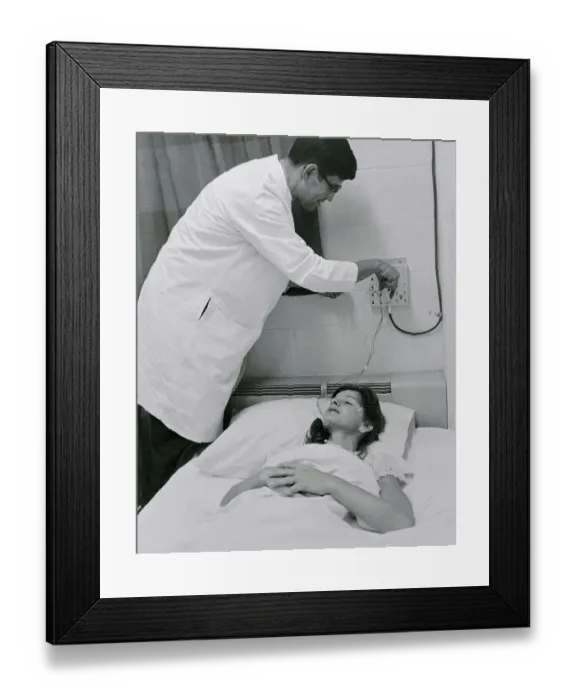 Framed Print : Doctor Attending to Patient Framed Print : Doctor Attending to Patient