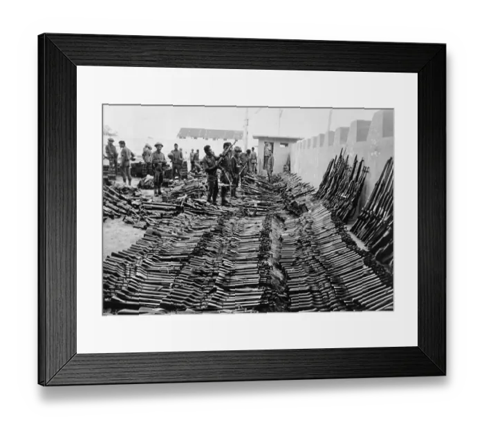 Framed Print : Soldiers Examine Captured Weapons Framed Print : Soldiers Examine Captured Weapons