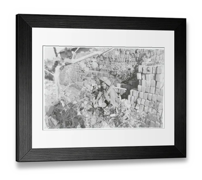 Framed Print : Soldier Sheltering near Wall Framed Print : Soldier Sheltering near Wall