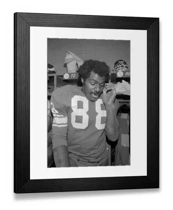 Framed Print : Alan Page Wearing Football Uniform in Locker Room Framed Print : Alan Page Wearing Football Uniform in Locker Room