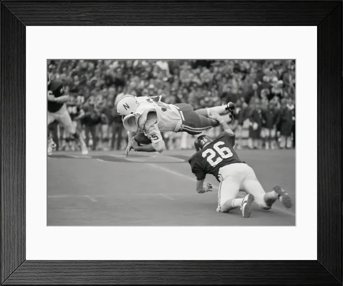 Framed Print : Cornhusker Running Back Gets Tripped Up By Sooners Tackler Framed Print : Cornhusker Running Back Gets Tripped Up By Sooners Tackler
