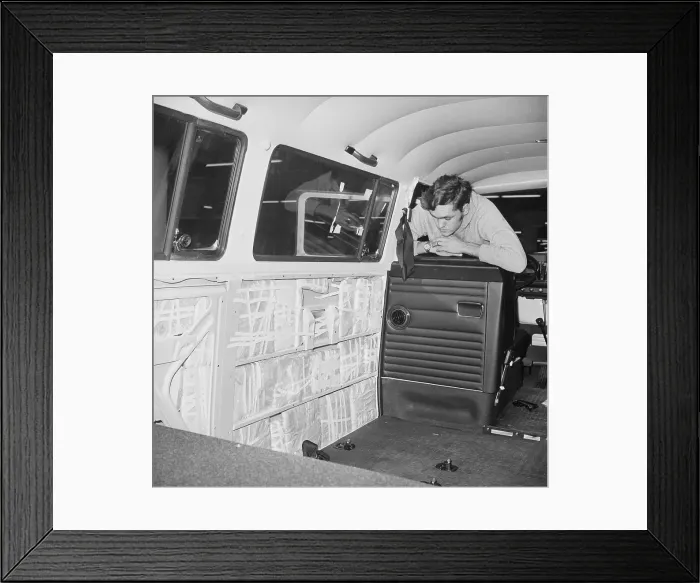 Framed Print : Customs Inspector Looks At Bus Panels Framed Print : Customs Inspector Looks At Bus Panels