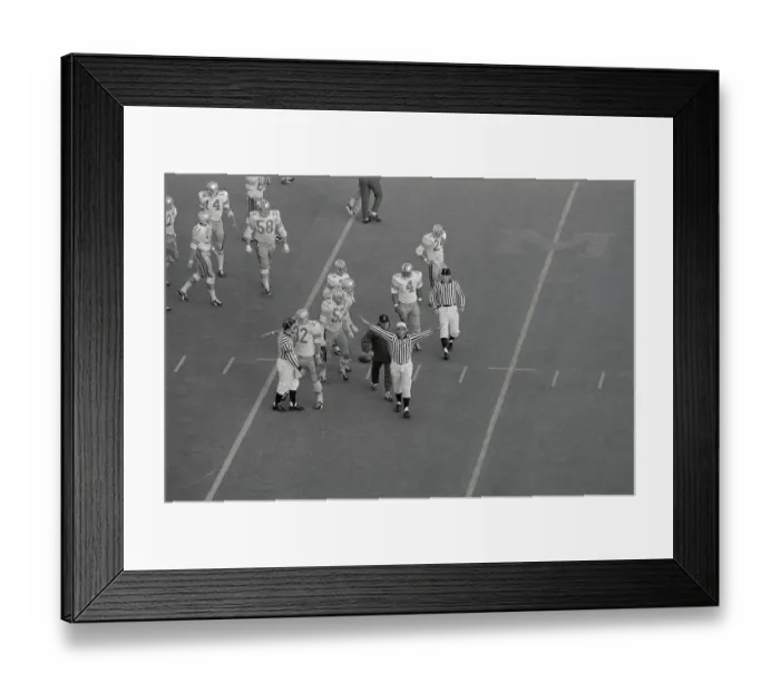 Framed Print : Referee Making Call During Football Game