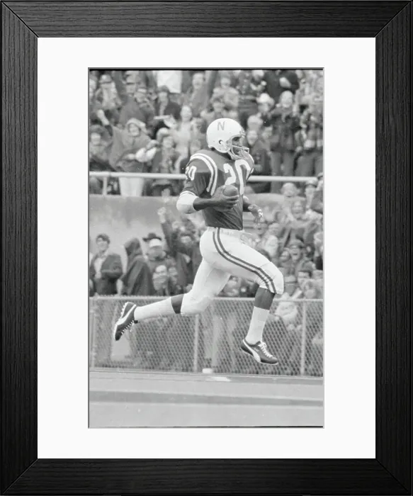 Framed Print : Johnny Rodgers Running In Air with Ball Framed Print : Johnny Rodgers Running In Air with Ball
