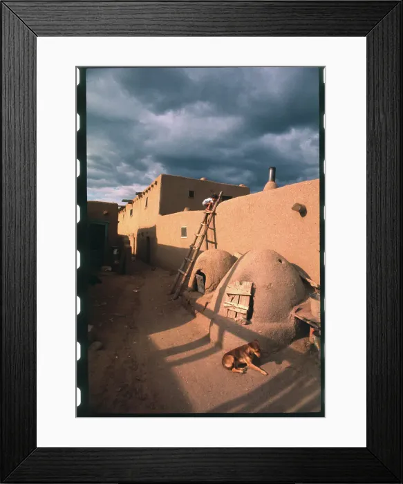 Framed Print : Youngster Climbing Adobe Wall Framed Print : Youngster Climbing Adobe Wall