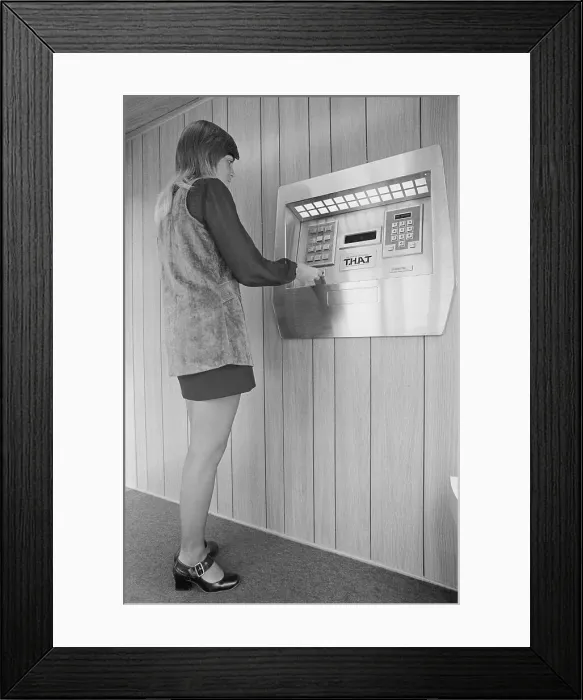 Framed Print : Woman Demonstrating First Automated Teller Machine at Bank Framed Print : Woman Demonstrating First Automated Teller Machine at Bank