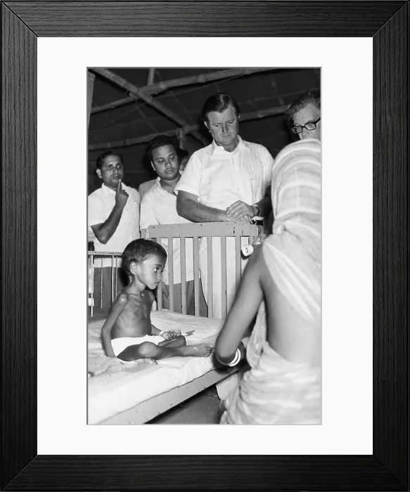 Framed Print : Edward Kennedy Visiting Malnourished Refugee Child Framed Print : Edward Kennedy Visiting Malnourished Refugee Child