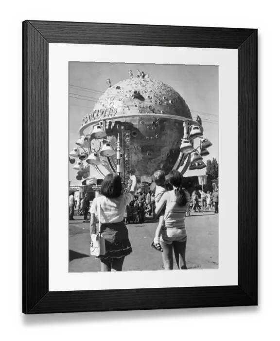 Framed Print : Visitors Watching the Moon Ride Framed Print : Visitors Watching the Moon Ride