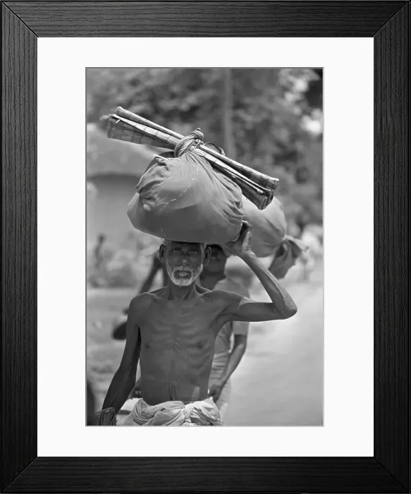 Framed Print : Man Carrying Belongings On Head Framed Print : Man Carrying Belongings On Head