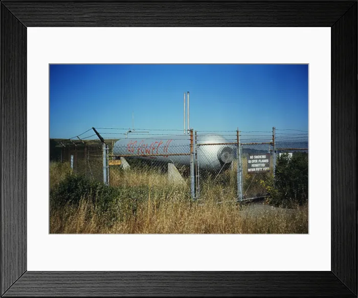 Framed Print : Fuel Tank Behind Fence Framed Print : Fuel Tank Behind Fence