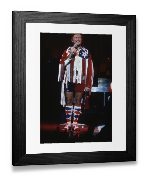 Framed Print : Liberace wearing hot pants costume, dances and sings through comedian Red Framed Print : Liberace wearing hot pants costume, dances and sings through comedian Red