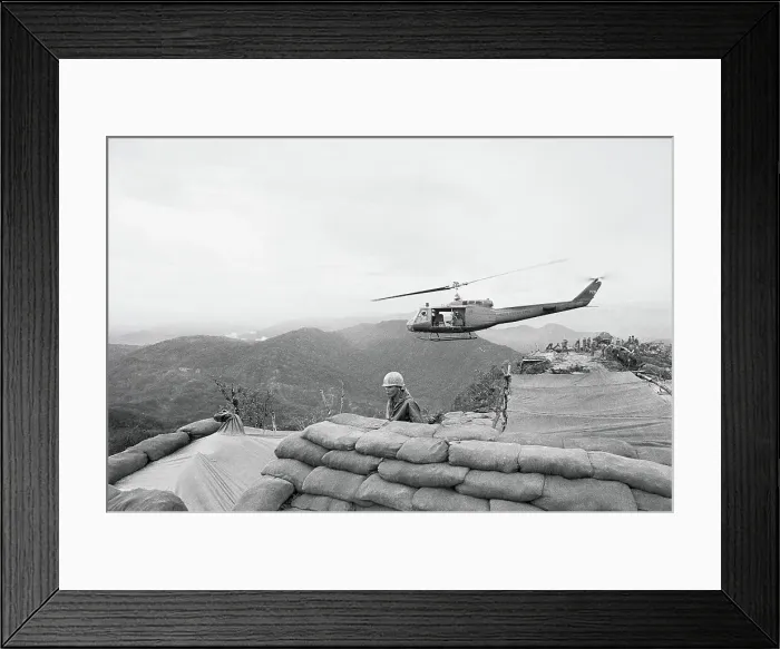 Framed Print : Helicopter Hovering over Sandbags Framed Print : Helicopter Hovering over Sandbags