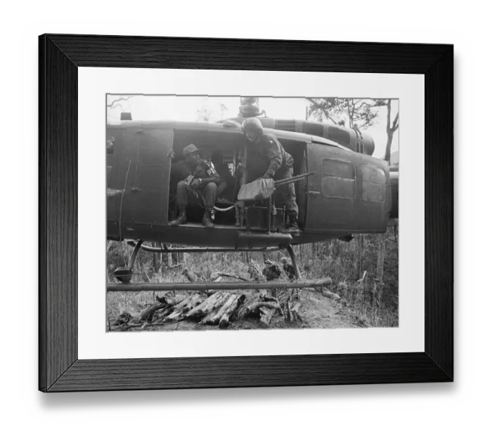 Framed Print : Helicopter Flying Above Running Soldier Framed Print : Helicopter Flying Above Running Soldier