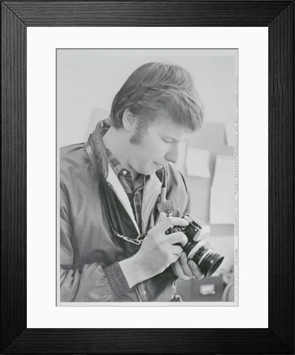 Framed Print : Man Looking at His Camera Framed Print : Man Looking at His Camera