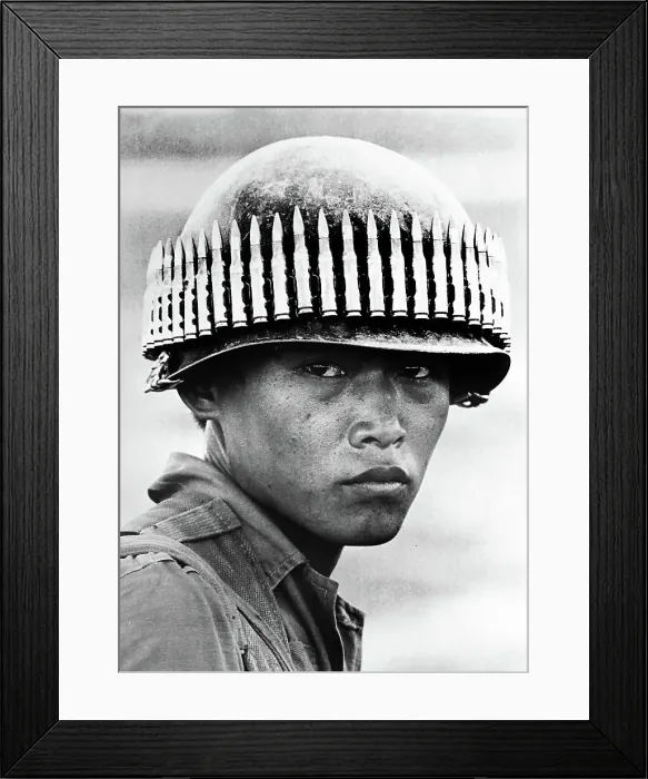 Framed Print : Vietnam Soldier with bullet-studded helmet Framed Print : Vietnam Soldier with bullet-studded helmet