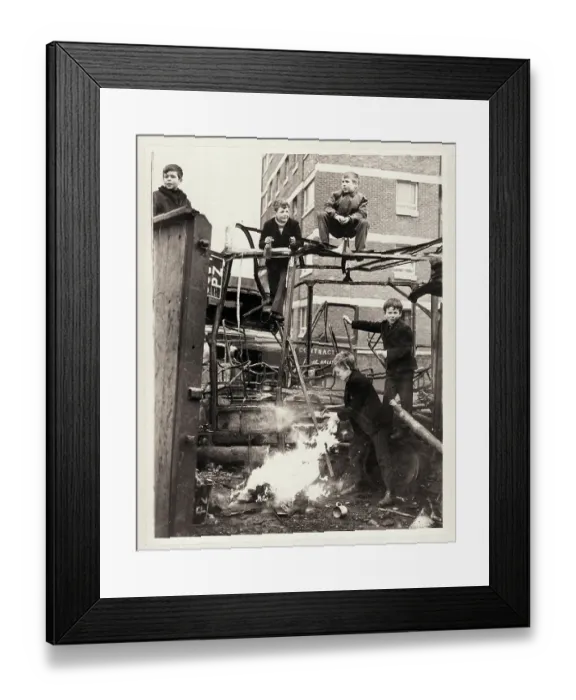 Framed Print : Boys Climb on Burnt Out Automobile Framed Print : Boys Climb on Burnt Out Automobile