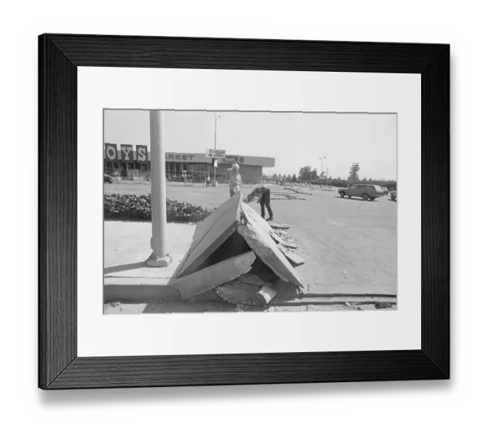 Framed Print : Boys Peer Under Buckled Concrete Road Framed Print : Boys Peer Under Buckled Concrete Road