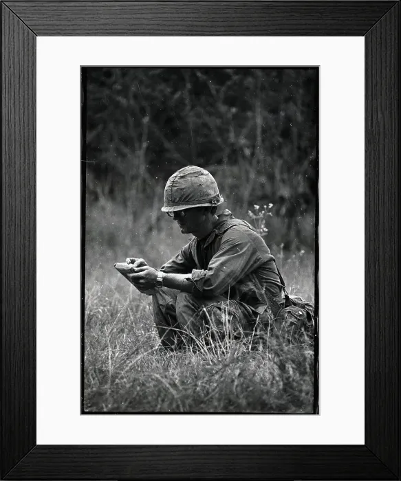 Framed Print : Photographer Dana Stone Seated and Reading Framed Print : Photographer Dana Stone Seated and Reading