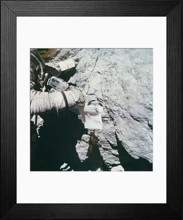 Framed Print : Charles Duke Looking at Lunar Rock Framed Print : Charles Duke Looking at Lunar Rock