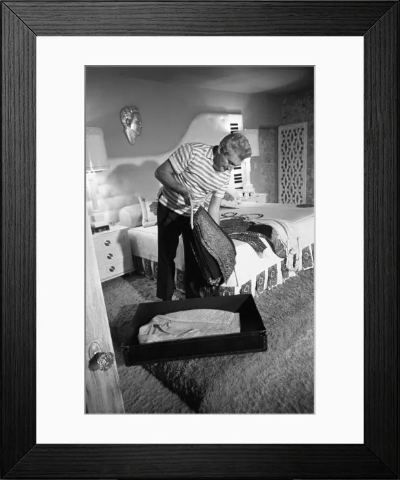 Framed Print : Liberace packing for his tour. He was ready to leave as soon as the photo shoot was over Framed Print : Liberace packing for his tour. He was ready to leave as soon as the photo shoot was over