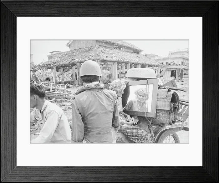 Framed Print : Soldier Gazing at Woman Exiting War Torn Town with Possessions Framed Print : Soldier Gazing at Woman Exiting War Torn Town with Possessions