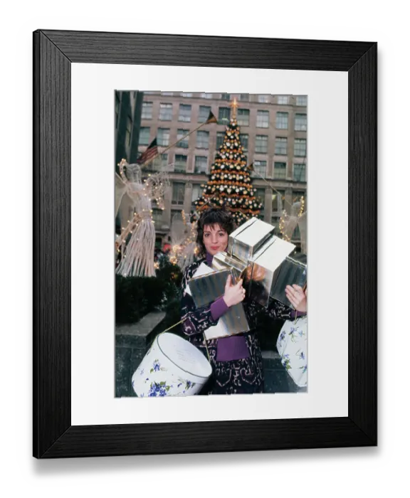 Framed Print : Liza Minnelli Holding Christmas Presents Framed Print : Liza Minnelli Holding Christmas Presents
