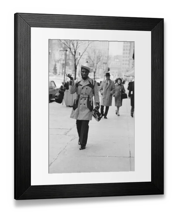 Framed Print : Joe Frazier Carrying Gloves and Guitar Framed Print : Joe Frazier Carrying Gloves and Guitar