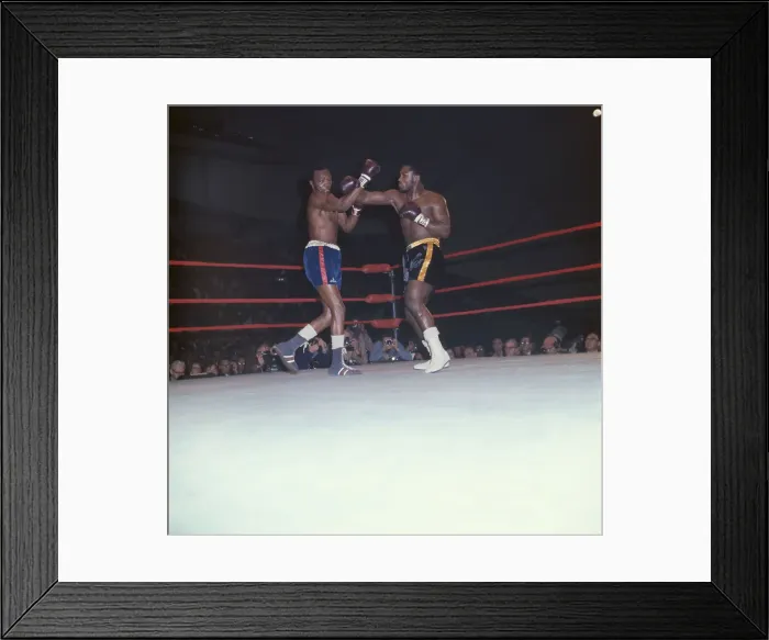 Framed Print : Foster Tries to Block a Frazier Left Hook Framed Print : Foster Tries to Block a Frazier Left Hook