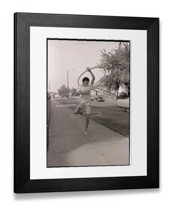 Framed Print : Boy Demonstrates Hula Hoop Technique