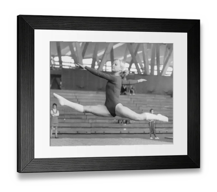 Framed Print : Gymnast Performing Scissor Split Framed Print : Gymnast Performing Scissor Split