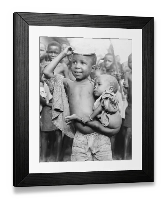 Framed Print : Young Nigerian Boy Smiling and Carrying His Younger Sibling Framed Print : Young Nigerian Boy Smiling and Carrying His Younger Sibling