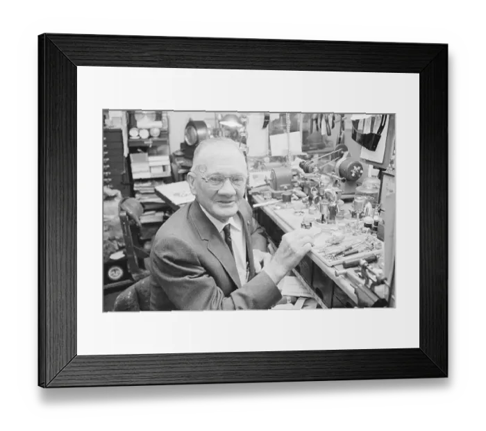 Framed Print : Jeweller Seated at Workbench Framed Print : Jeweller Seated at Workbench